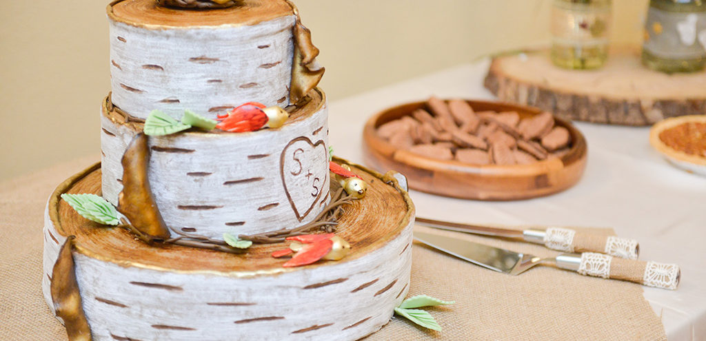 a tiered cake made to look like rounds of birch