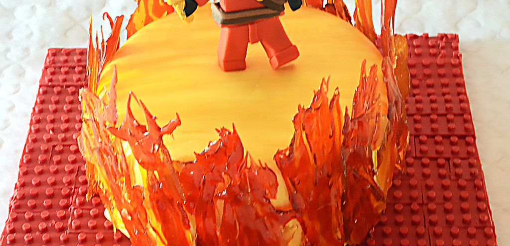 Cake with a red ninja, surrounded by candy fire
