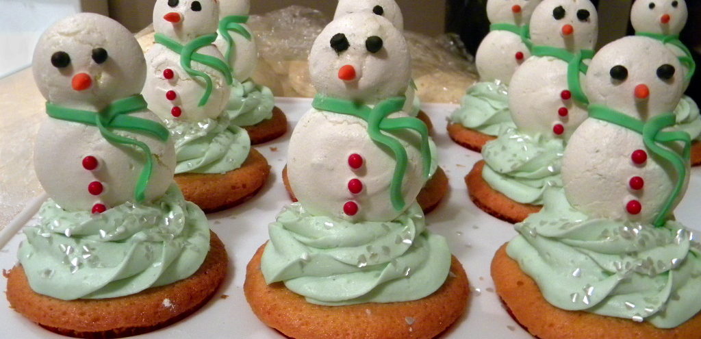 Cupcakes with meringue snowmen on top