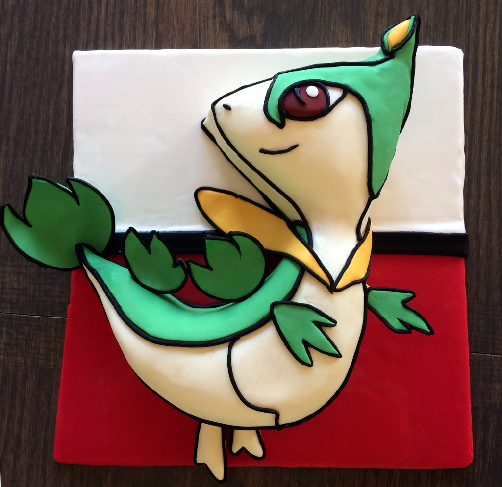 Novelty cake in the shape of the Pokemon character Servine